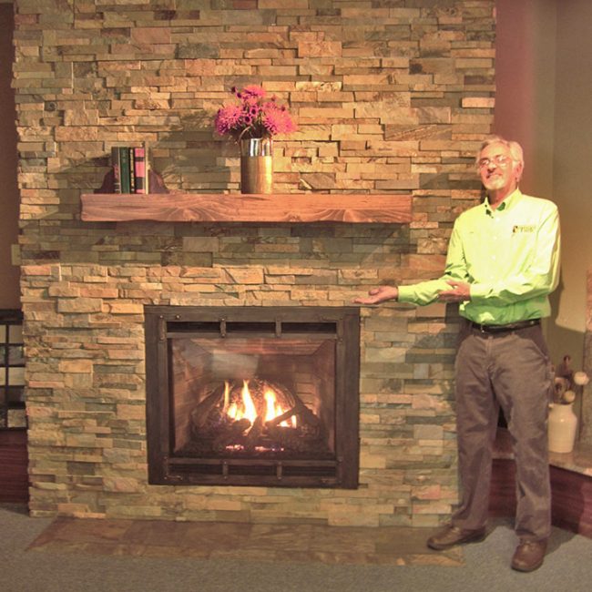  professional showing off our fireplace in dubuque ia