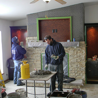 custom fireplace mantel and faux stone